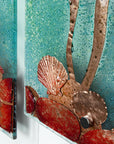 Seashell copper details on a fused glass staggered triptych, with hand-etched copper seahorses and ocean flora and an ocean blue background.