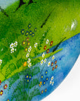 Floral detailing on a fused glass round panel, inspired by the Nearly Home Trees in Devon, designed in bright summer greens.