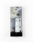 A fused glass extra small wall panel, featuring a lighthouse design with a full moon. A soft coastal piece of wall art.