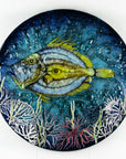 Round fused glass wall panel, with hand-painted john dory design in vibrant organic colours and textures.