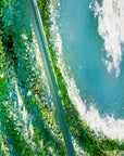 Textured detailing on a fused glass triptych featuring a giant ocean wave, with aqua and sea green colours and white texture.
