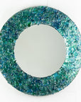 Fused glass round mirror handmade using crushed, recycled glass to create an ocean inspired piece of wall art.