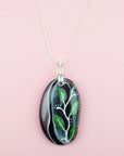 Fused glass pendant necklace, handmade in spring greens and pinks, with botanical hand-painted design.