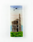 A fused glass extra small wall panel, featuring soft sunset sky, coastal landscape, soaring birds and a Cornish tin mine. A handmade piece of wall art.