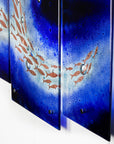 Fused glass triptych featuring a royal blue colour-way, with swirling copper fish, handmade in a beautiful ocean inspired design.