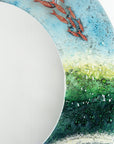 close up of fused glass round mirror with ocean inspired design and copper fish detailing. Handmade, bespoke wall art.