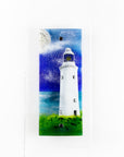 Fused glass wall panel with lighthouse and moon design in coastal colours. Handmade glass panel, designed in Cornwall.