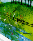 Hand-painted detail on Fused glass art frame with countryside design and vibrant greens.