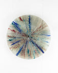 Fused glass circular panel featuring soft, coastal colours.