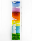 Fused glass wall panel, featuring a Cornish lighthouse design with a sunset sky.