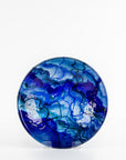 Fused glass round dish, featuring ocean blue colours and organic detail.