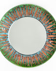 Fused glass round mirror featuring a soft, coastal colour-way with copper fish, creating an ocean inspired piece of wall art.