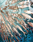 Close up of copper fish on a teal blue round fused glass panel. An ocean inspired wall art design.