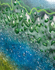 Details of abstract round panel inspired by the ocean with textured detail.
