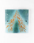 Fused glass square wall panel, featuring sea green colours and copper fish detailing.