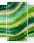 Fused glass triptych made with emerald green colours inspired by the sea.