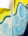 Fused glass triptych inspired by the ocean with starfish detailing and coastal colours.