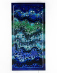Abstract and bright fused glass wall panel, inspired by the ocean, with coastal colours and bubbled detail.
