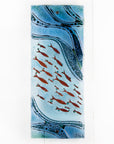 Fused glass wall panel, designed with copper fish and marine blue hues.
