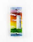 Handmade wall panel featuring a lighthouse with bright sunset colours. Gorgeous Artisan wall art piece, designed in Cornwall.