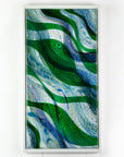Fused glass oblong art frame with coastal greens and textural blues with glass fish.