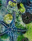 Close up of intricate ocean reef inspired fused glass art frame. Bright ocean blue colours and handmade wall art.