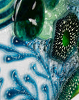 Close up of intricate ocean reef inspired fused glass art frame. Bright ocean blue colours and handmade wall art.
