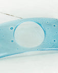 A blue glass soap dish with a subtle aqua color-way and bubble texture, handmade.