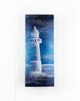 Fused glass wall panel with a lighthouse design in dark blues. Handmade wall art piece.