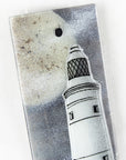 Close up of fused glass extra small wall panel, featuring a lighthouse design with a full moon. A soft coastal piece of wall art.