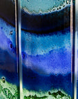 A detailed image of a fused glass quintych featuring an ocean blue colour-way, inspired by the coast