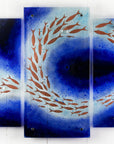 Fused glass triptych featuring a royal blue colour-way, with swirling copper fish, handmade in a beautiful ocean inspired design. 