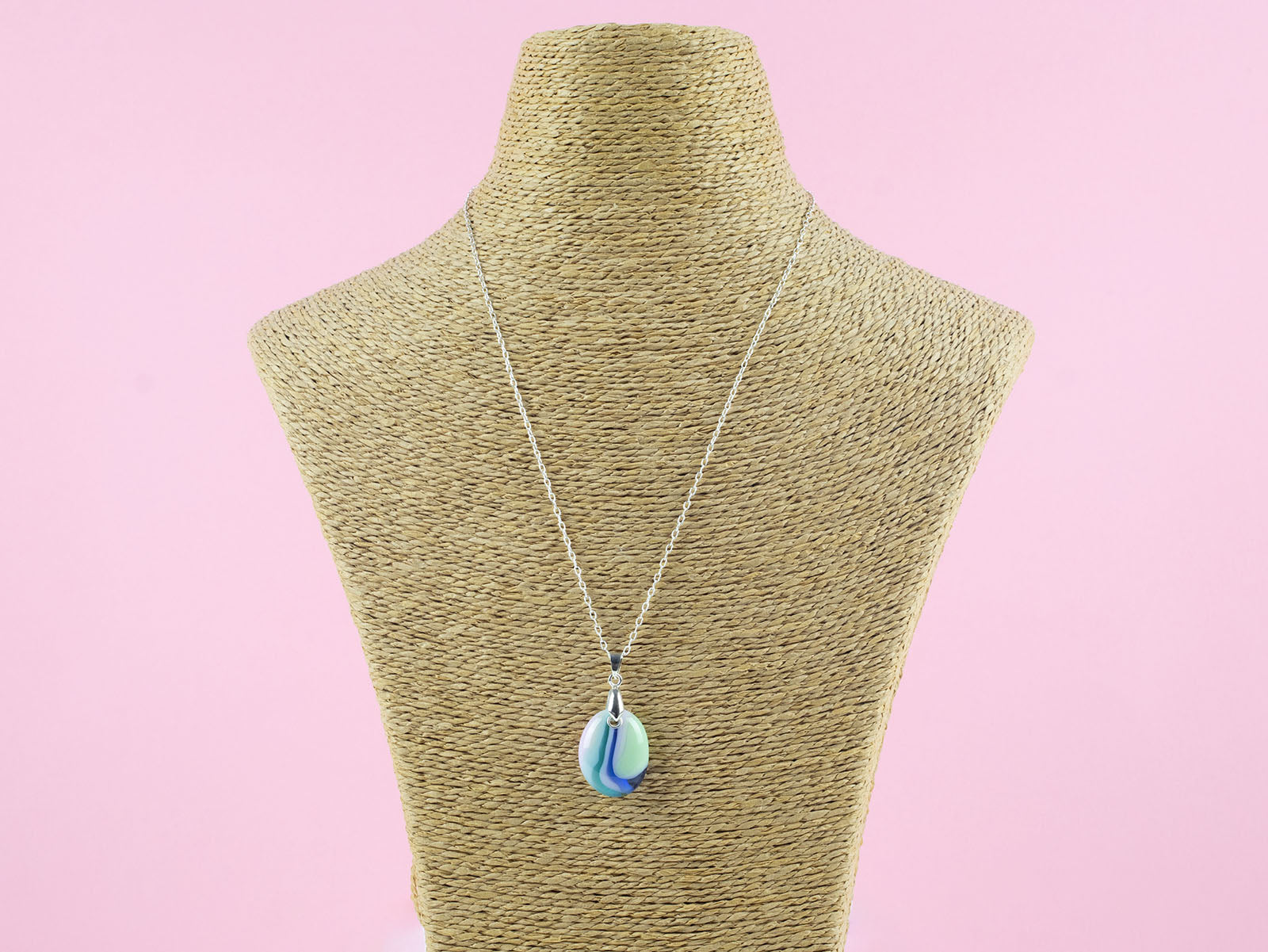 A fused glass pedant necklace, hung o a sterling silver chain, handmade in pastel, spring colours. 