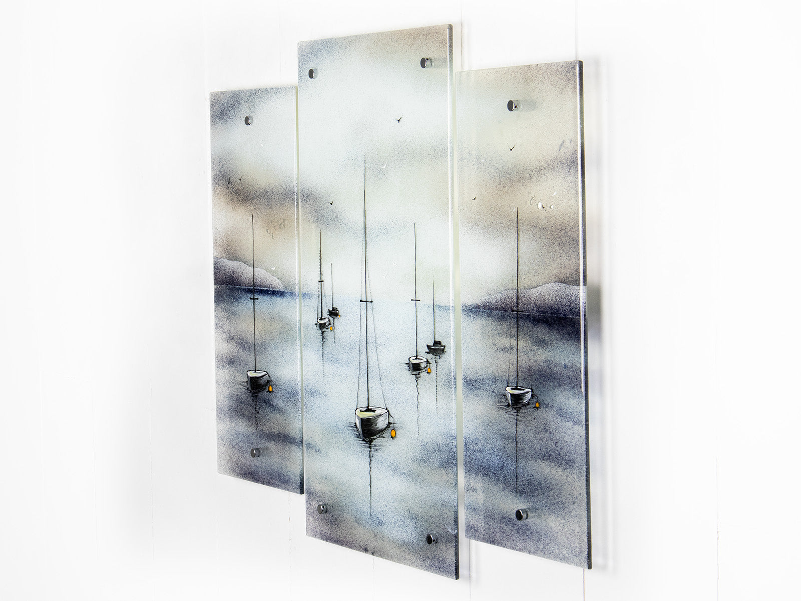 Fused glass staggered triptych featuring a hand-painted sailboat design in a soft and misty colour-way. 