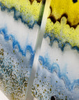 A close up of fused glass small triptych wall art piece, handmade in coastal, soft, organic colours, inspired by the Cornish beaches.