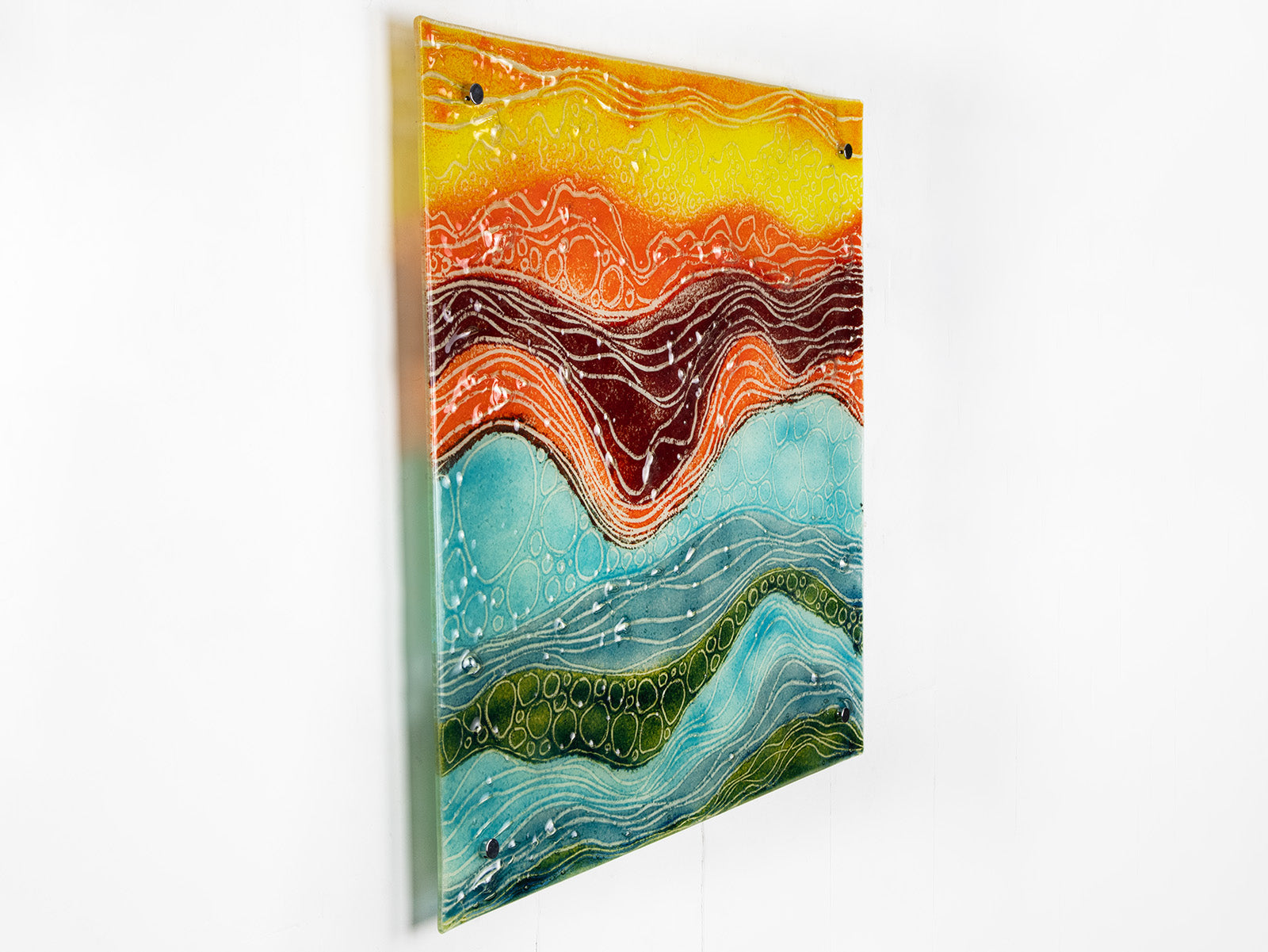 Side image of fused glass abstract, multi coloured square wall panel. 