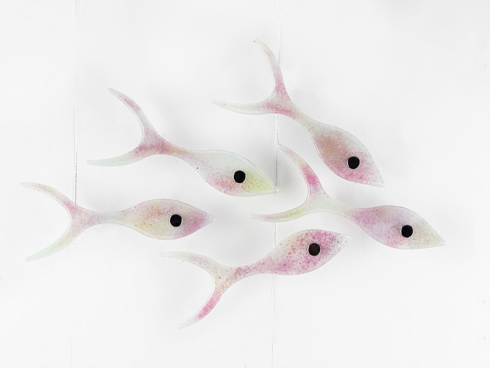 Small fused glass shoal of fish, handmade in soft pinks and pearly whites. 