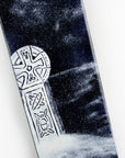A close up of a fused glass panel featuring a monochrome design of a Cornish Celtic Cross. 