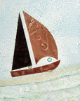 A close up of a sail boat designed on a fused glass wave sculpture with a metal sail boat and a soft coastal colour-way, with textured details. 