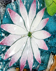 A detailed shot of the lily in a fused glass round panel featuring hand-painted koi carp design with waterlilies and marine blue background. 