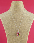 Fused glass pendant necklace, handmade in bright red hues, hung on a sterling silver chain.