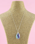 Fused glass pendant necklace in soft turquoise and pink hues Handmade in organic colours and presented on a sterling silver chain. 