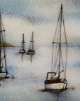 Close up of a hand-painted fused glass design of several sailboats anchored, designed in soft coastal colours.