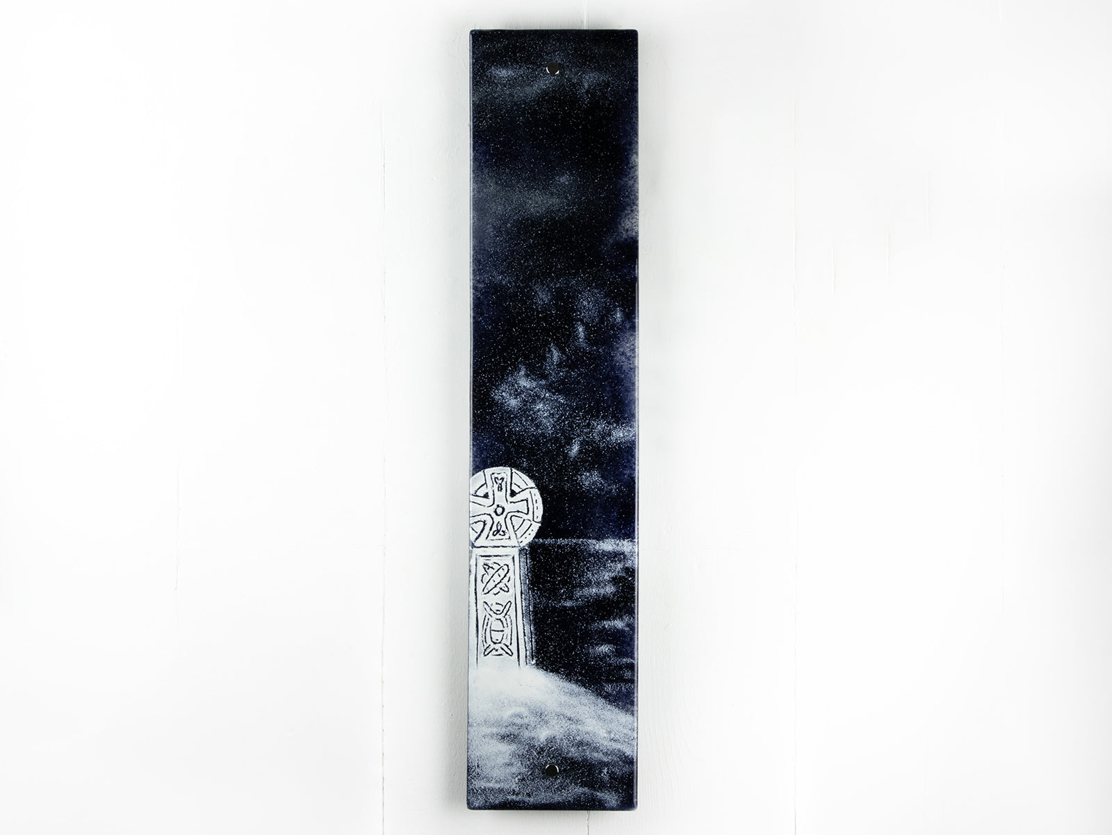 A fused glass panel featuring a monochrome design of a Cornish Celtic Cross. 