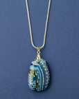 A signature by Jo Downs fused glass pendant necklace handmade using some of Jo's innovative techniques in rich ocean blues. Finished with a sterling silver chain and fittings. 
