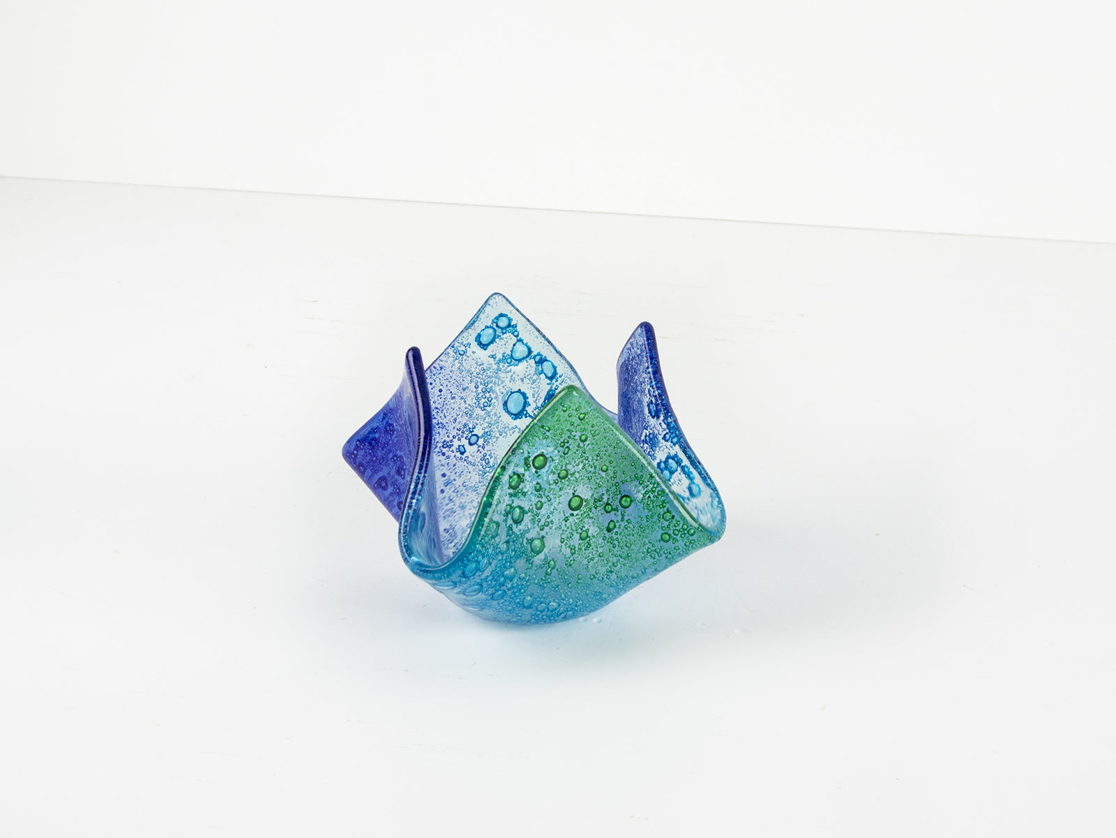 Fused glass fold form vase, handmade in coastal blues and greens. 