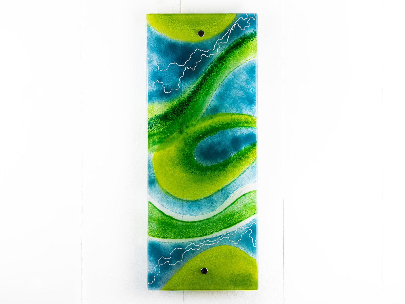 A fused glass wall panel in vibrant marine colours, in an abstract design. Hand-made in our Cornish studio. 