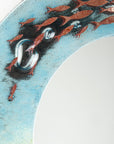 Close up of fused glass round mirror with ocean inspired design and copper fish detailing. Handmade, bespoke wall art. 