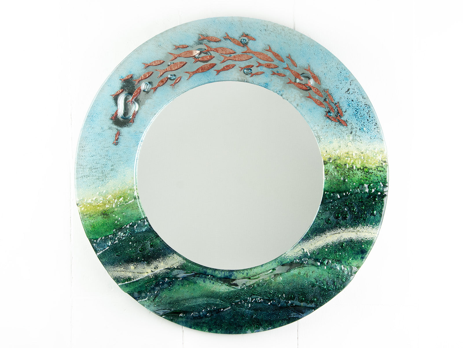 Fused glass round mirror with ocean inspired design and copper fish detailing. Handmade, bespoke wall art. 