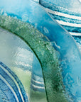 Close up of fused glass large vase handmade in Cornish studio in coastal blue colours. Stunning homeware piece of sculptural glass. 